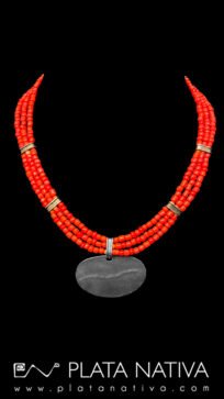 red necklace with silver center